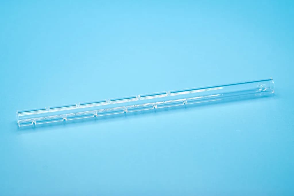 Quartz crucible, 210 x 13 x 9 mm, with 11 slits offset by 180 degrees, 2 drilling above